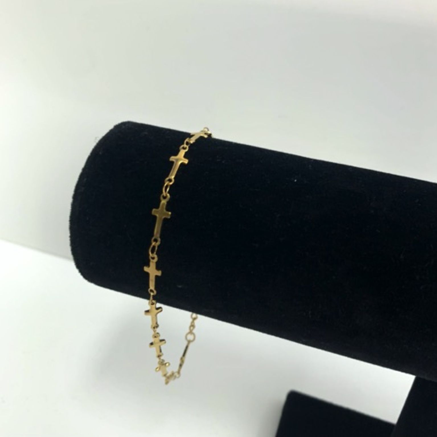 MA47208 - Armband geschakelde kruisjes goud